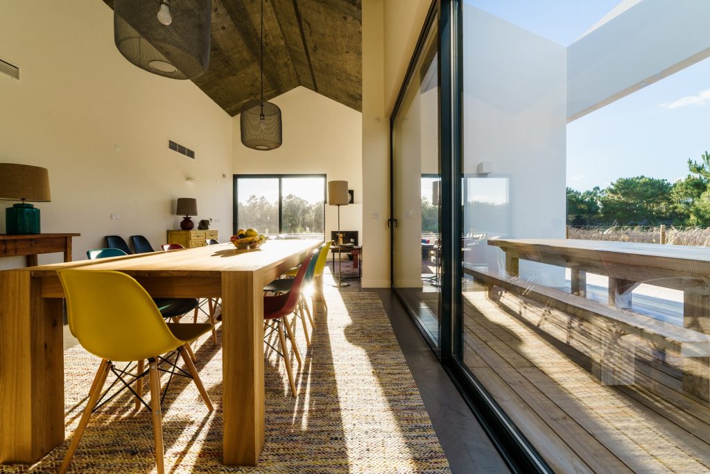 Modern house with garden swimming pool and wooden deck